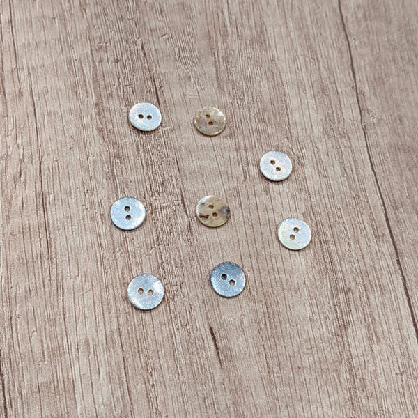 Bouton nacre blanc paillette scintillante 10 mm