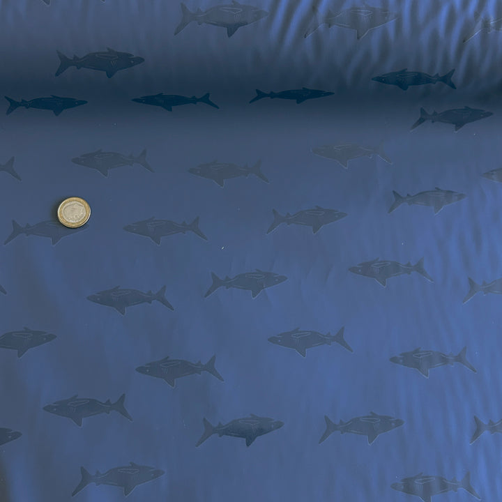 Tissu imperméable ciré bleu requin brillant