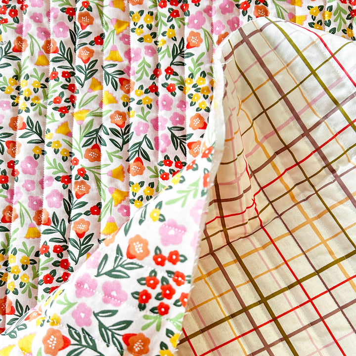 Matelassé coton double face fleur rose orange et carreau