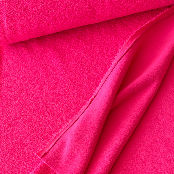 Fausse fourrure double face bouclette/polaire rose fluo