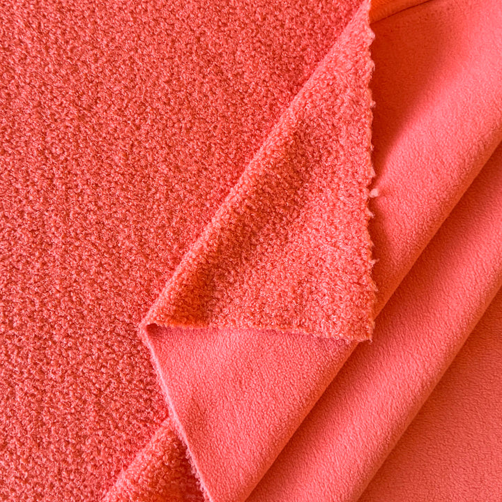 Fausse fourrure double face bouclette/polaire orange sanguine