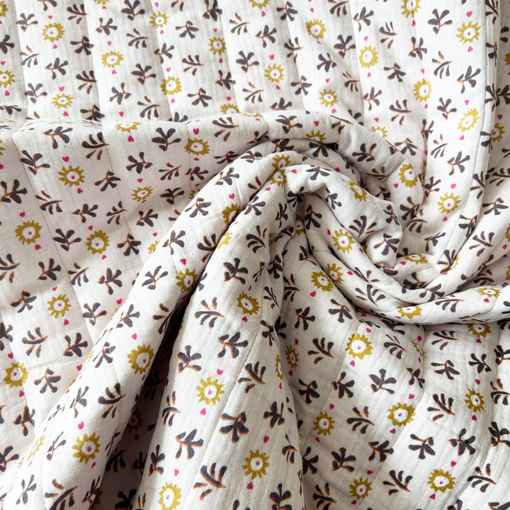 Matelassé coton double gaze fuschia et blanc fleurs