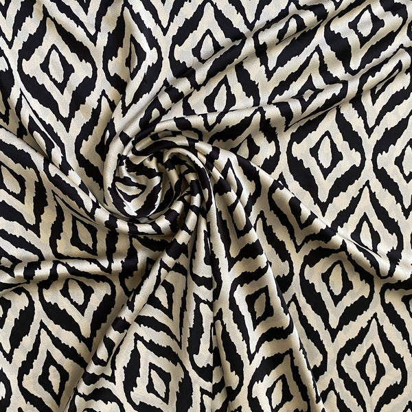 Tissu satiné noir et écru graphique