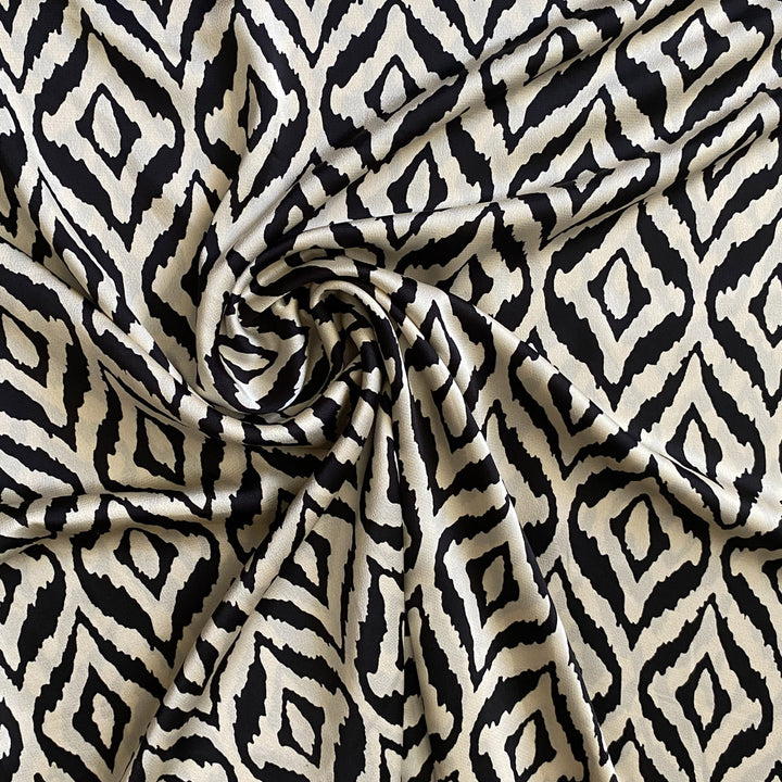Tissu satiné noir et écru graphique