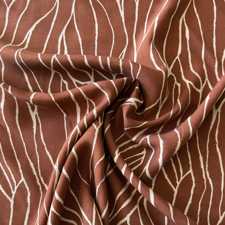 Sergé viscose brique imprimé abstrait