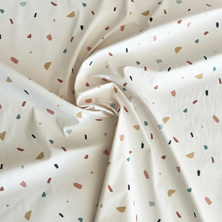 Tissu imperméable écru miettes