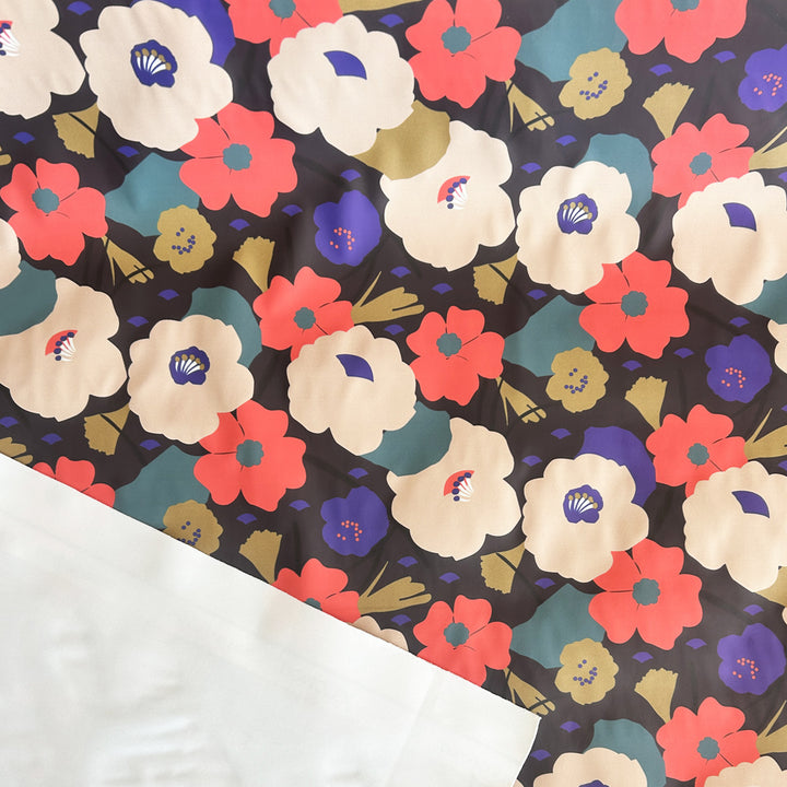 Tissu imperméable cirée noir multi fleurs