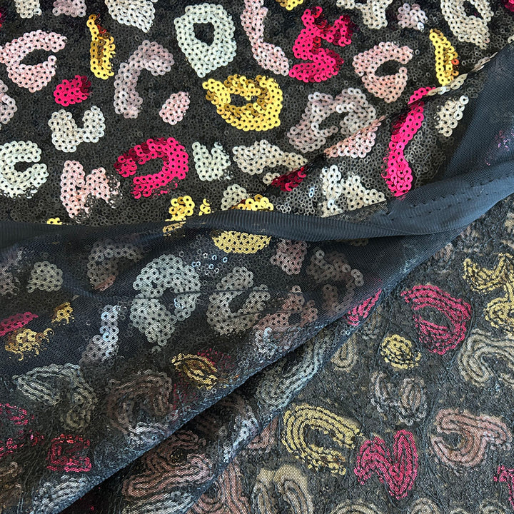 Tissu sequins rose noire et champagne fondu animal