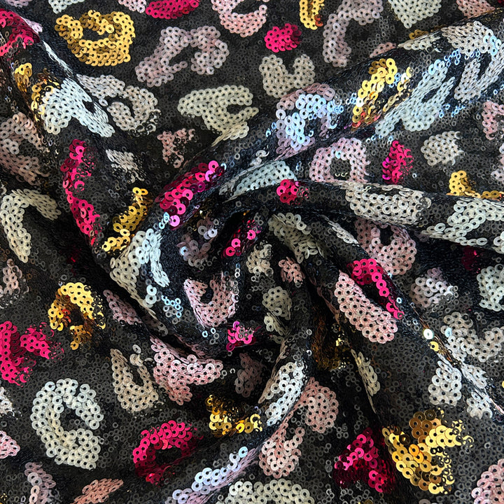 Tissu sequins rose noire et champagne fondu animal