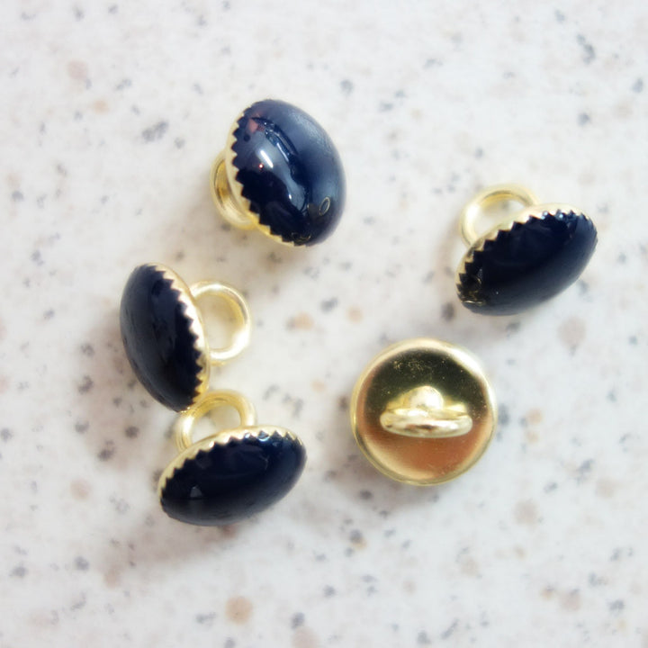 Boutons marine cerclage dentelé or 9 mm