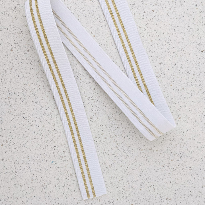 Elastique blanc fines rayures or