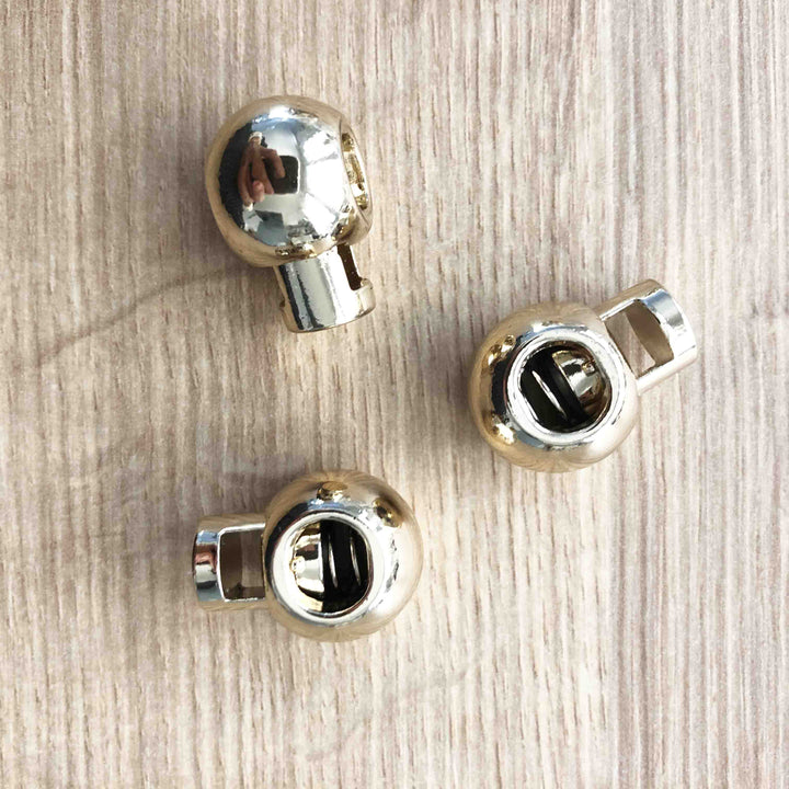 Boule stopper cordon métal or